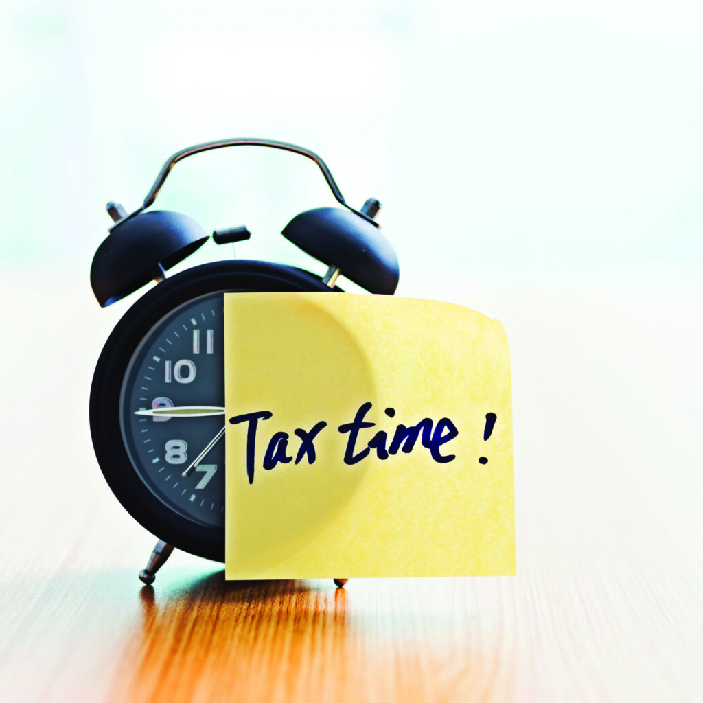 Tax Time Sticky Note On Clock