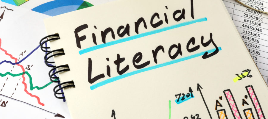 Financial Literacy Written On A Notepad Sheet.